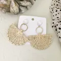 Detail of bohemian fan-shaped woven earrings with white studs and natural straw texture - Fan Shape Style 12