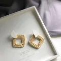 Square natural rattan drop earrings with white semicircular studs on a minimal tray - Square Rattan Woven / White Semicircle Wood