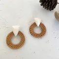 Bohemian round rattan earrings with white resin triangle details on textured background - Dark Rattan - Beige