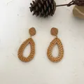 Handmade bohemian rattan earrings in teardrop shape with natural fiber weave finish - Dark Woven Oval