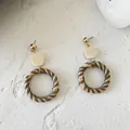 Close-up of geometric rattan hoop earrings with gold studs and wooden details - New Rattan Woven 25 (Gold Top Tri-color Rings)