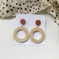 Handmade woven rattan hoop earrings with brown wooden studs on white display card - New Rattan Weave 9 (Dark Wood Top Ring)