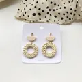 Detail of geometric straw woven earrings with wood splice on elegant white display card - New Rattan Woven 6 (Gold Dome & Wood Semicircle)