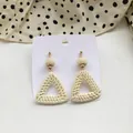 Detailed view of cream woven rattan earrings with geometric triangular drop design - Woven Rattan Ball with Triangle