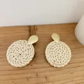 Bohemian rattan hoop earrings with gold teardrop studs on a rustic wooden background - Light Color Round Disc Rattan (B05)
