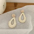 Bohemian cream woven teardrop earrings with round wood studs on rustic fabric background - Light Color Rattan (B49)