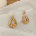 Bohemian handmade teardrop rattan earrings with wood studs on white fabric background - Dark Color Rattan (B49)