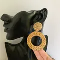 Detail of handmade bohemian woven straw earrings featuring circular rattan design on model - New Rattan Woven 17 (Solid Circle with Large Ring)