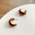 Retro C-shaped wooden hoop earrings with silver pins on a minimalist white display - C-Shaped (C32) / Brown