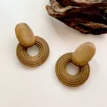 Retro geometric spiral wooden hoop earrings for women with a natural brown timber finish - Coil Shape / Brown