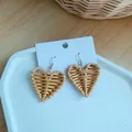 Detailed close-up of handmade woven straw heart earrings on white card display - Heart Woven Style (B26 Heart)