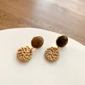 Retro geometric woven rattan earrings with dark brown wood studs and golden metal borders - Dark Color Rattan