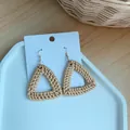 Close-up of handmade triangular woven straw earrings with gold hooks on a white display card - Dark Triangle Woven Style (B27)
