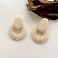 Minimalist cream white geometric circle drop earrings with concentric spiral texture - Coil Shape / Off White