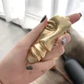 Artistic gold matte abstract face ring with sculpted features and brushed metal finish - Color Preservation Plating Style / Gold