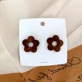 Minimalist dark brown wooden flower stud earrings with hollow center on display card - 2.3cm In Diameter / Brown