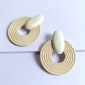 Minimalist geometric large round wooden spiral earrings featuring cream oval studs - White