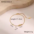 Detail of 18k gold plated titanium chain with zircon charms and fish pendant - Gold Little Fish Style (NMSB-K433-4)