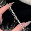Elegant silver tennis bracelet with sparkling round zircons and adjustable slider clasp - Pavé Interlocking Loop Bracelet