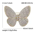 Sparkling butterfly rhinestone brooch in gold finish measuring 3.1cm by 4.0cm - Gold