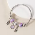Detailed macro view of ocean themed silver charm bracelet with purple shells and starfish - Silver Purple Shell Starfish Style (26)
