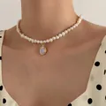 Elegant natural freshwater pearl necklace with oval moonstone pendant on a woman model - Moonstone Pearl Style