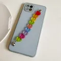 Blue silicone phone case featuring a colorful rainbow heart resin chain decoration - G238 Multicolor Heart