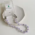 Detail of transparent phone case with purple flower beads and faux pearl strap - Purple Flower