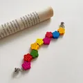 Close-up of colorful wooden flower beads and silver metal clasps for mobile phone straps - Raindrop Pattern Wooden Colorful Flower Phone Chain