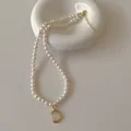 Elegant freshwater pearl necklace with an oval moonstone pendant and gold chain - Small Pearl Moonstone Style