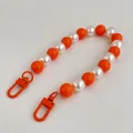 Detail of bright orange and pearl white beads on a lanyard with metal lobster clasps - Orange Mixed Color Phone Chain