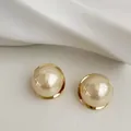 Elegant geometric pearl earrings with champagne finish and polished gold metal base - Shell Pearl (Champagne Gold)