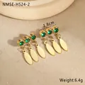 Detail showing gold teardrop earrings with green cubic zirconia on a stone dish - Triple Willow Leaf Tassel Style (NMSE-H524-2)