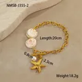 Detailed shot of golden star necklace with white sea shells and round pearl pendant - Round Shell Bracelet