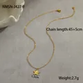 Detail of gold star pendant necklace with 45+5cm chain length and 1.5cm width measurements - 18K Gold / Heart Necklace