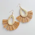 Detailed view of handmade teardrop woven rattan earrings with brown raffia fringe tassels - Light Teardrop Woven Rattan Brown Raffia Style (B341)