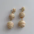 Handmade raffia ball drop earrings with three-tier bohemian woven design for summer beach wear - Striped