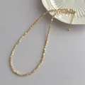 Detail of champagne shell bead necklace with gold lobster clasp and extension chain - Brown (G278)