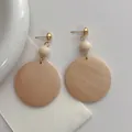 Bohemian large wooden hoop dangle earrings with natural grain and gold metal connectors - Beige