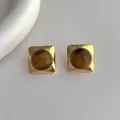 Macro detail of vintage gold square earrings featuring natural brown tiger eye stones - Coffee (N322)