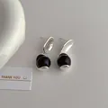 Detail showing silver irregular metal studs with glossy dark purple beads on a textured surface - Tiger Eye Silver (L-99) / Silver/Black