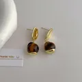 Detail of gold tiger eye drop earrings with S925 silver studs on white background - Tiger Eye Gold (L-99) / Gold/Brown