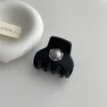 Close-up of black matte claw clip with grey round inlay and silver metal trim detail - Grey Pearl Style