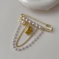 Vintage style pearl fringe brooch with gold pin and dangling heart pendant - Pearl Tassel Style