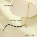 Detail of beaded stainless steel bracelet with sunburst coin pendant and lobster clasp - Black Style (NMSB-B828-4)