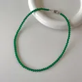 Close-up of green chalcedony beaded necklace with silver buckle on ceramic tray - Beaded Necklace (V-27) / 4mm / Green