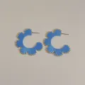 Detail of blue raffia woven C-shaped hoop earrings with gold trim in bohemian style - Blue