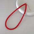 Detailaufnahme der roten Achat-Perlenkette mit verstellbarem goldenem Metallverschluss - Roter Stil (V-34) / 6mm