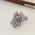 Detail of elegant gunmetal bear hair claw clip showing hollow metal wirework and sturdy spring - Gun Black (R12)
