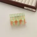 Checkerboard hair claw clip in pastel green and orange resin for women hair styling - Green Grid